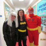 Three people in superhero costumes
