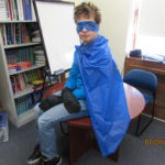 Student dressed as a blue superhero