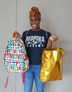 college shower distributes bags to graduating students 