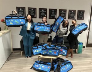 New York Life Nassau donating Sweet Case bags for youth in foster care.